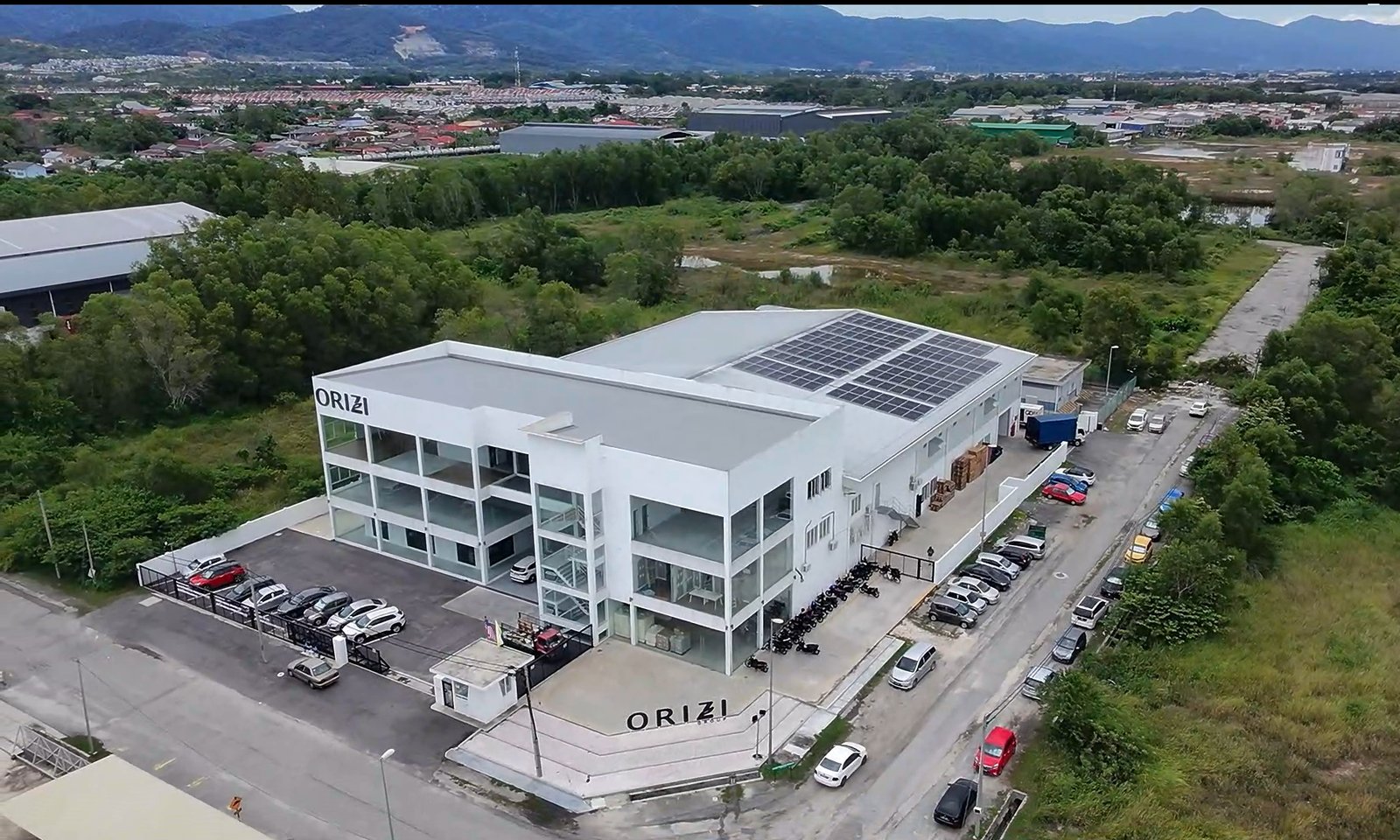Aerial view of ORIZI Group manufacturing facility with rooftop solar panels
