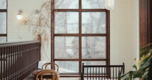 Vintage heritage cafe interior with checkered tile floor and arched windows, representing Malaysian heritage F&B restaurant group Malaya Heritage Holding