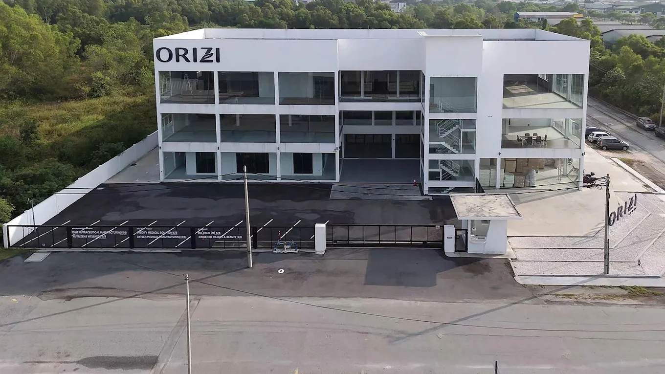 Aerial view of the ORIZI Group campus in Kawasan Perindustrian Pengkalan Ipoh with group company signboards at the gate